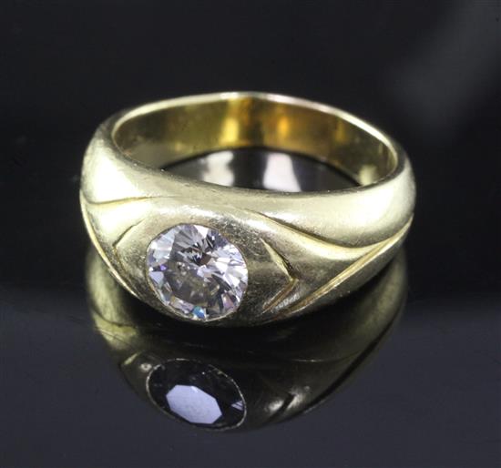 A gentlemens 18ct yellow gold and gypsy set solitaire diamond ring, size Q.